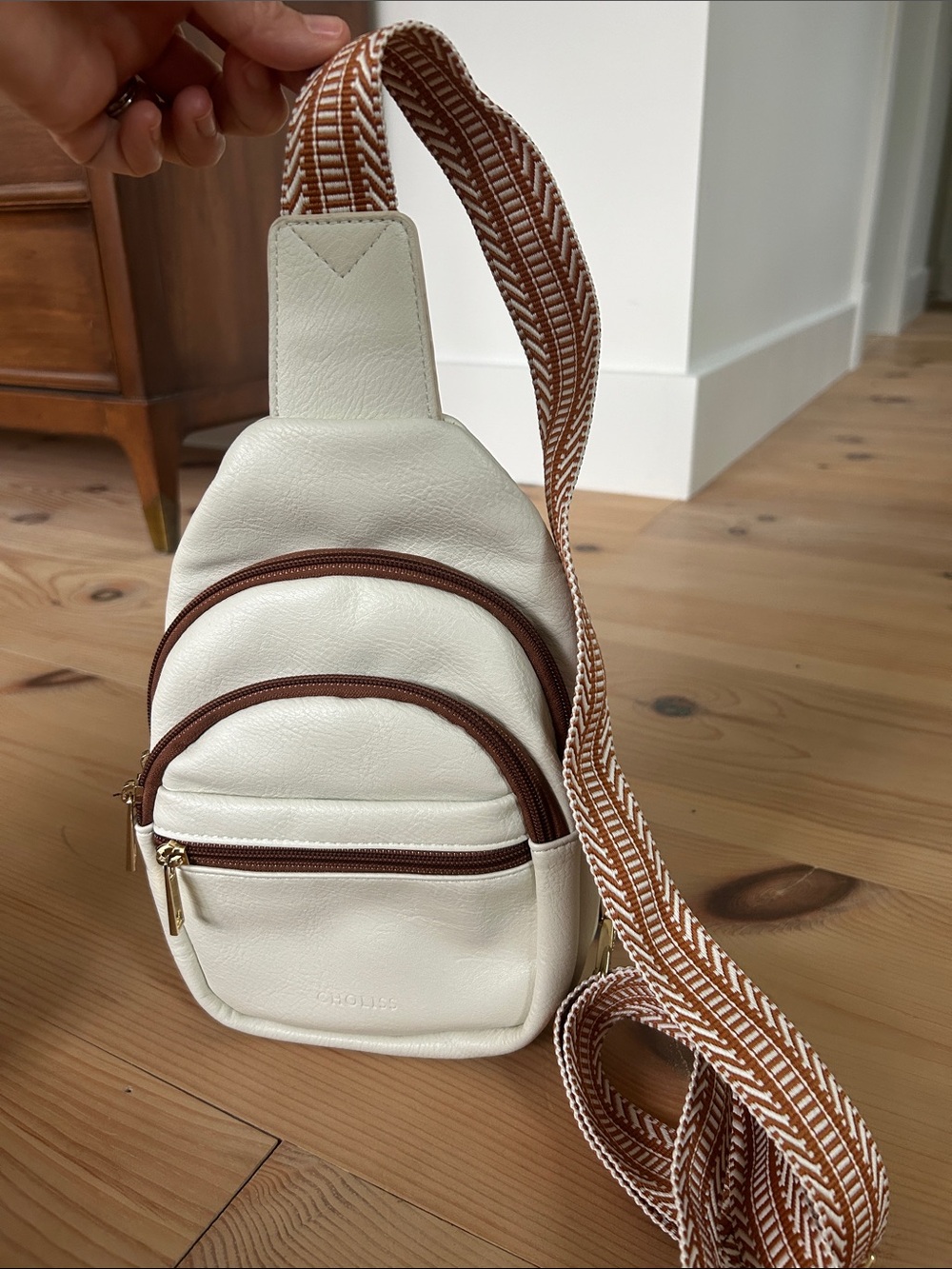 Cream Crossbody Sling Bag with Brown Trim and Patterned Strap